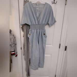 Stylish Light Blue Jumpsuit with Gold Button